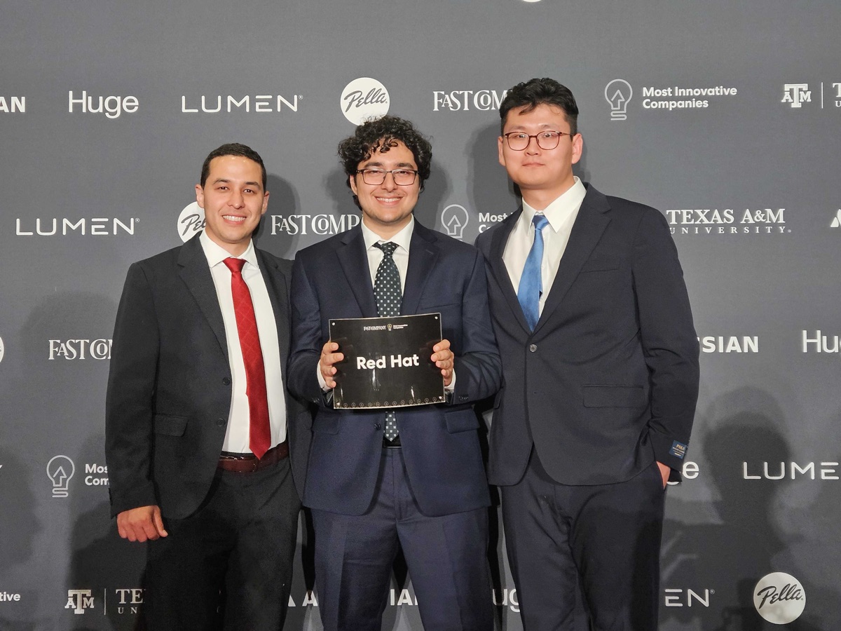 Guangxuan Xu accepting the Fast Company Most Innovative Companies award on behalf of Red Hat